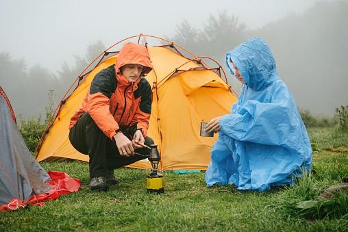 tourists camping in the rain